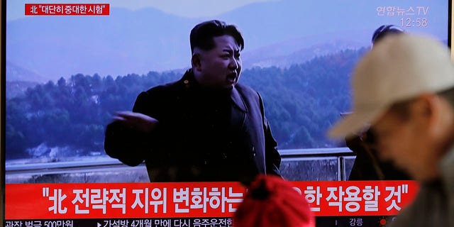 People watch a TV news program reporting North Korea's announcement with a file footage of North Korean leader Kim Jong Un, at the Seoul Railway Station in Seoul, South Korea, Sunday, Dec. 8, 2019. The letters, top left, read "North. Very important test." (Associated Press)