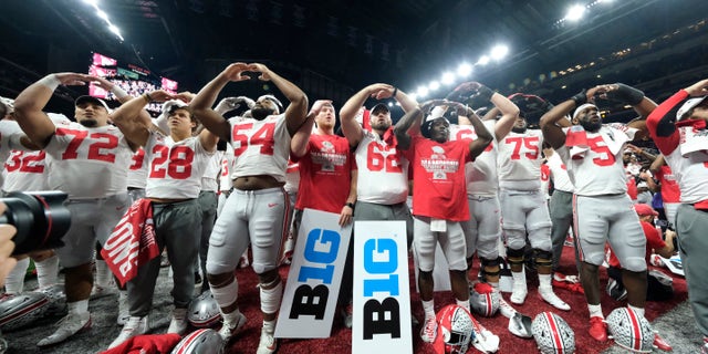 Ohio State players celebrate the team's 34-21 win over Wisconsin in the Big Ten championship NCAA college football game, early Sunday, Dec. 8, 2019, in Indianapolis. (AP Photo/AJ Mast)