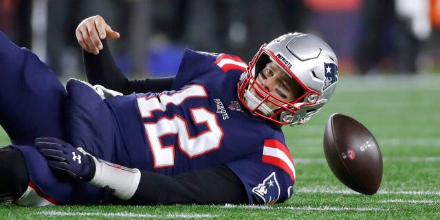 New England Patriots quarterback Tom Brady lands on the turf after being sacked by Kansas City Chiefs defensive end Chris Jones in the second half of an NFL football game, Sunday, Dec. 8, 2019, in Foxborough, Mass.