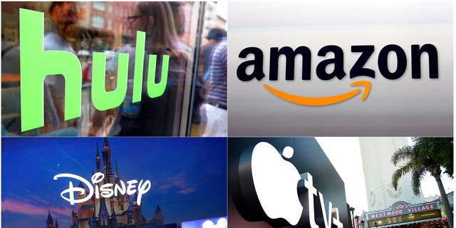 This combination photo shows, clockwise from top left, the Hulu logo on a window at the Milk Studios space in New York, the Amazon logo in Santa Monica, Calif., the Apple TV+ logo displayed outside the Regency Village Theatre in Los Angeles before the premiere of the Apple TV+ series "See," and a screengrab of the Disney Plus streaming service on a computer screen. (AP Photo)