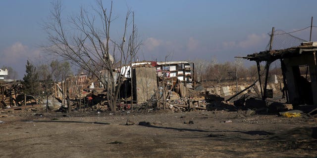 Damaged shops are seen after an attack near Bagram Air Base in Kabul, Afghanistan, on Wednesday.