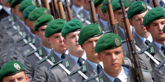 Soldiers attend an oath-taking ceremony of the German army at the Defence Ministry in Berlin, Germany.