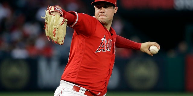 In this June 29, 2019, file photo, Los Angeles Angels starting pitcher Tyler Skaggs throws to the Oakland Athletics during a baseball game in Anaheim, Calif. Talks to add testing for opioids began following the death of Skaggs, who was found dead in his hotel room in the Dallas area July 1 before the start of a series against the Texas Rangers. (AP Photo/Marcio Jose Sanchez, File)