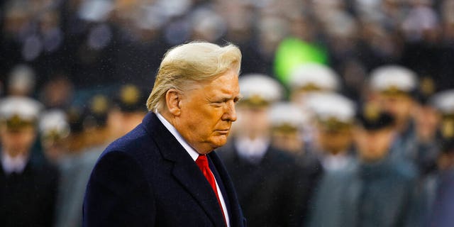 President Donald Trump walks onto the field ahead of an NCAA college football game between Army and Navy, Saturday, Dec. 14, 2019, in Philadelphia. (Associated Press)