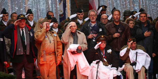 U.S. Battle of the Bulge veterans, front row, listen to the U.S. national anthem during a ceremony to commemorate the 75th anniversary of the Battle of the Bulge at the Mardasson Memorial in Bastogne, Belgium on Monday, Dec. 16, 2019. The Battle of the Bulge, also called Battle of the Ardennes, took place between Dec. 1944 and Jan. 1945 and was the last major German offensive on the Western Front during World War II. 