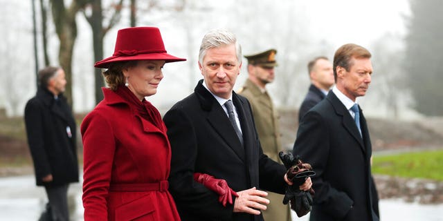 Belgium's King Philippe, center, Belgium's Queen Mathilde and Luxembourg's Grand Duke Henri, right, leave at the end of a ceremony to commemorate the 75th anniversary of the Battle of the Bulge at the Mardasson Memorial in Bastogne, Belgium on Monday, Dec. 16, 2019. 