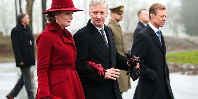 Belgium's King Philippe, center, Belgium's Queen Mathilde and Luxembourg's Grand Duke Henri, right, leave at the end of a ceremony to commemorate the 75th anniversary of the Battle of the Bulge at the Mardasson Memorial in Bastogne, Belgium on Monday, Dec. 16, 2019.