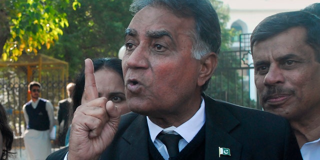 Akhtar Sheikh, a lawyer for former Pakistani military ruler Gen. Pervez Musharraf, talks to media outside a court following a court decision, in Islamabad, Pakistan, Dec. 17, 2019. The Pakistani court sentenced Musharraf to death in a treason case related to the state of emergency he imposed in 2007 while in power, officials said. Musharraf who is apparently sick and receiving treatment in Dubai where he lives was not present in the courtroom. (AP Photo/Anjum Naveed)