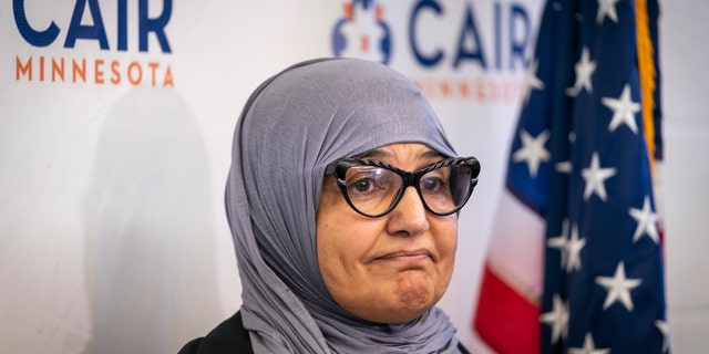Aida Shyef Al-Kadi, of St. Louis Park, attends a press conference at CAIR-MN headquarters in Minneapolis on Tuesday. Al-Kadi reached a settlement with Ramsey County for $120,000 after claiming religious discrimination after being forced to remove her hijab for a booking photo and go without a hijab for a time while in jail. (Leila Navidi/Star Tribune via AP)