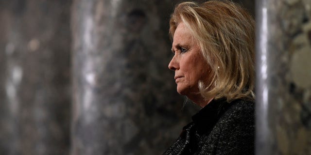 Rep. Debbie Dingell, D-Mich, speaks to reporters on Capitol Hill in Washington, Wednesday, Dec. 18, 2019. (AP Photo/Susan Walsh)