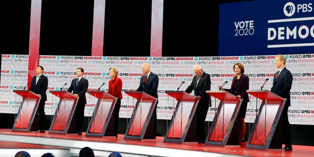 Democratic presidential candidates from left, entrepreneur Andrew Yang, South Bend Mayor Pete Buttigieg, Sen. Elizabeth Warren, D-Mass., former Vice President Joe Biden, Sen. Bernie Sanders, I-Vt., Sen. Amy Klobuchar, D-Minn., and businessman Tom Steyer stand on stage during a Democratic presidential primary debate Thursday, Dec. 19, 2019, in Los Angeles. (Associated Press)