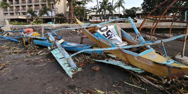 An outrigger boat destroyed by Typhoon Phanfone on the coastline Thursday in Ormoc City, central Philippines.