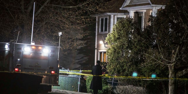 An Orthodox Jewish man stands in front of a residence in Monsey, N.Y., Sunday, Dec. 29, 2019, following a stabbing late Saturday during a Hanukkah celebration. A man attacked the celebration at the rabbi's home north of New York City late Saturday, stabbing and wounding several people before fleeing in a vehicle, police said. (Associated Press)