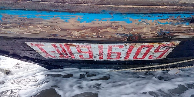 This Saturday, Dec. 28, 2019, photo provided by Sado Coast Guard Station shows a part of a boat on Sado Island, Niigata Prefecture, northern Japan. The boat suspected of being from North Korea with several bodies was found on the small island, the Japanese Coast Guard said Sunday, Dec. 29, 2019. (Sado Coast Guard Station via AP)