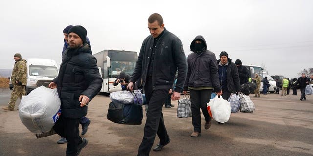 Ukrainian war prisoners released after a prisoner exchange, near Odradivka, eastern Ukraine, on Sunday.