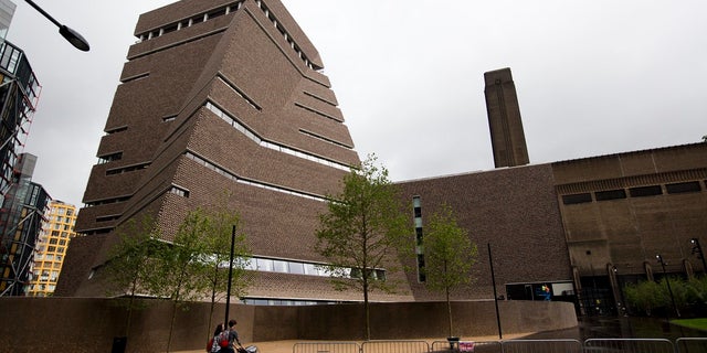 In this Tuesday, June 14, 2016 file photo, an exterior view shows a new building called the Switch House, at left, which has been added on to the Tate Modern gallery in London. London police have charged a man with criminal damage after an attack on a Picasso painting at the Tate Modern gallery. (AP Photo/Matt Dunham, file)