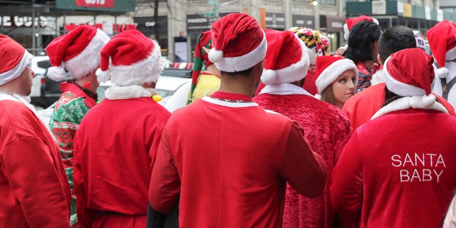 Thousands dressed up as Santa Claus, reindeer, elves and other festive holiday characters participated in New York City's SantaCon on Saturday.