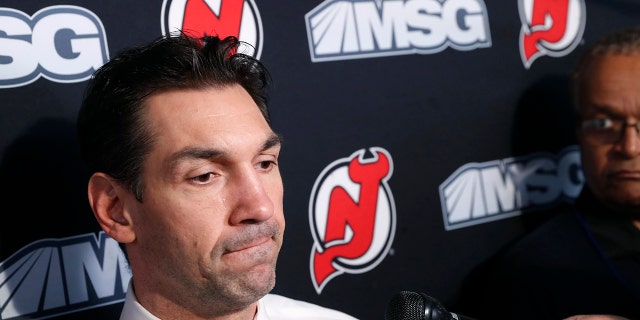 New Jersey Devils interim coach Alain Nasreddine speaks to the media before an NHL hockey game against the Vegas Golden Knights, Tuesday, Dec. 3, 2019, in Newark, N.J. Nasreddine was named interim head coach by Devils General Manager Ray Shero after the Devils fired head coach John Hynes earlier in the day. (AP Photo/Kathy Willens)