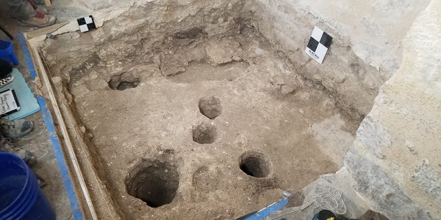 The excavation of the monks' burial room.