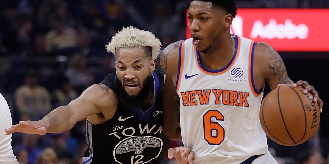 New York Knicks' Elfrid Payton, right, drives the ball against Golden State Warriors' Ky Bowman (12) in the first half of an NBA basketball game, Wednesday, Dec. 11, 2019, in San Francisco. (AP Photo/Ben Margot)