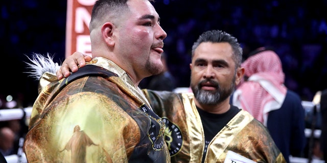 Andy Ruiz Jr. reacts after losing on points to Britain's Anthony Joshua in their World Heavyweight Championship contest at the Diriyah Arena, Riyadh, Saudi Arabia early Sunday Dec. 8, 2019. (Nick Potts/PA via AP)