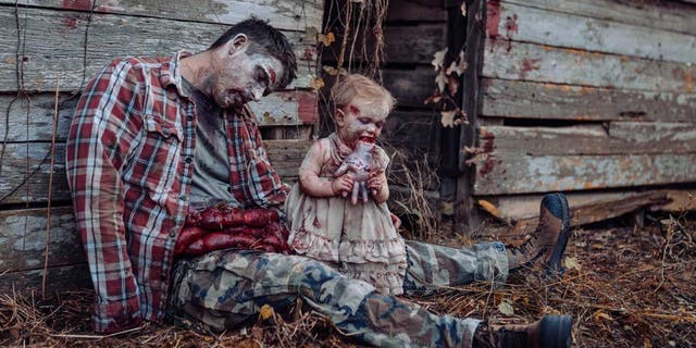 In honor of the spookiest day of the year, one Alabama mom staged a frightful Halloween-inspired photo shoot, depicting her husband and 11-month-old daughter as zombies, that immediately went viral online. (Tifflynn Photography)