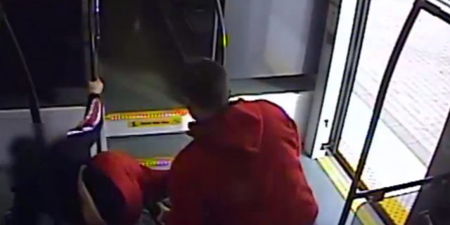 Austin Shurbutt is seen dumping a woman on the floor of a train from her wheelchair on Friday, Nov. 29.
