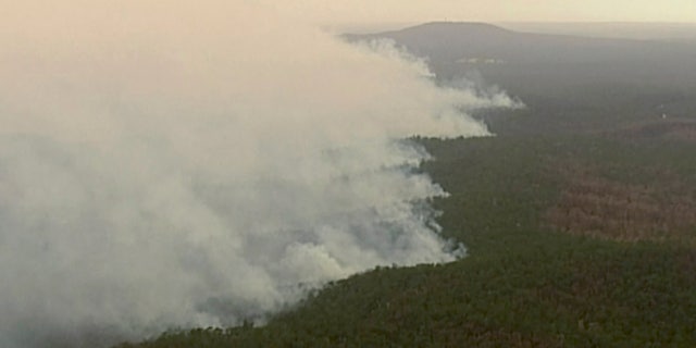 In this image made from video, an aerial view shows wildfires in the forests of Gippsland, Victoria, Australia, Dec. 31, 2019.