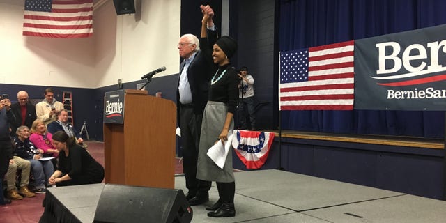 Rep. Ilhan Omar of Minnesota joins Democratic presidential candidate Sen. Bernie Sanders of Vermont at a campaign event in Manchester, NH on Dec. 13, 2019