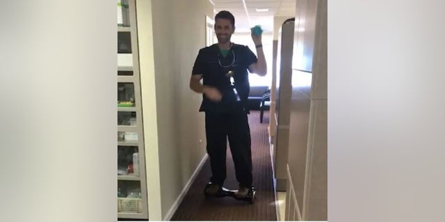 Alaska dentist Seth Lookhart in a video riding a hoverboard.