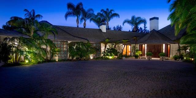 The property, which boasts 180-degree views, is designed to look like the deep tropics and includes palm trees, huge Monstera vines and tropical flowers.
