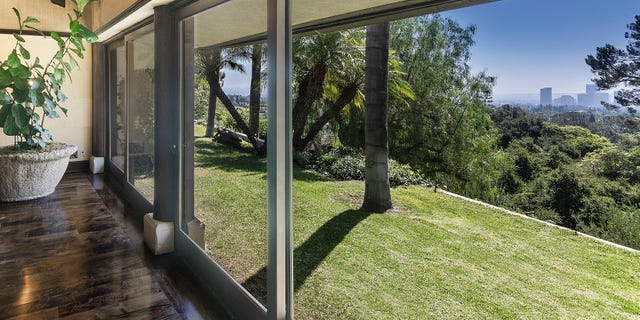 The house is also situated on a promontory, an area of high land, which provides it with an impressive 180-degree view overlooking the city.