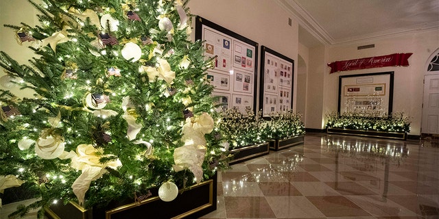 The American flag decorates a tree during the 2019 Christmas preview at the White House, Monday, Dec. 2, 2019, in Washington. [AP Photo/Alex Brandon)