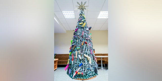 Vilnius Airport shared an image of the tree on LinkedIn, explaining that it was made exclusively using prohibited items that were taken from passengers’ carry-on luggage during security screening.