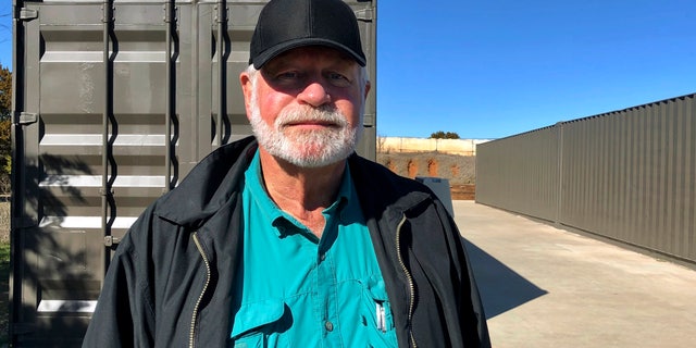 Jack Wilson, 71, poses for a photo at a firing range outside his home in Granbury, Texas, Monday, Dec. 30, 2019.