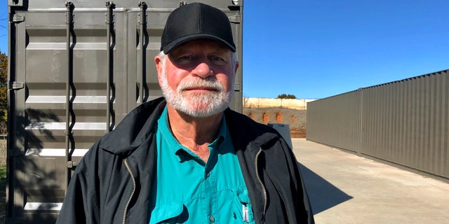 Jack Wilson, 71, poses for a photo at a firing range outside his home in Granbury, Texas, Monday, Dec. 30, 2019.