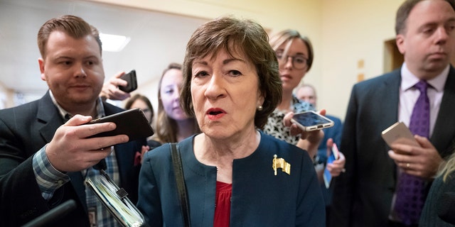 FILE - In this Nov. 6, 2019, file photo, Sen. Susan Collins, R-Maine, is surrounded by reporters as she heads to vote at the Capitol in Washington. (AP Photo/J. Scott Applewhite, File)