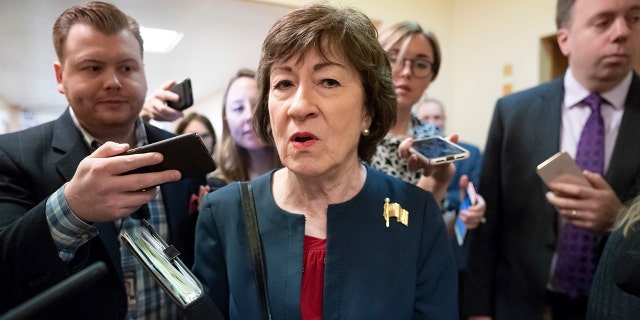 FILE - In this Nov. 6, 2019, file photo, Sen. Susan Collins, R-Maine, is surrounded by reporters as she heads to vote at the Capitol in Washington. (AP Photo/J. Scott Applewhite, File)