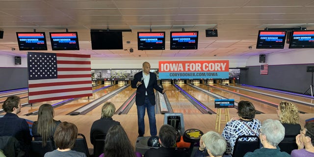 Democratic presidential candidate Sen. Cory Booker of New Jersey campaigns at a bowling alley in Adel, Iowa on Dec. 19, 2019