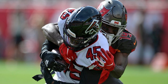 Atlanta Falcons linebacker Deion Jones (45) is stopped by Tampa Bay Buccaneers wide receiver Breshad Perriman (19) after Jones recovered a fumble by running back Ronald Jones II (27) during the first half of an NFL football game Sunday, Dec. 29, 2019, in Tampa, Fla. (AP Photo/Jason Behnken)