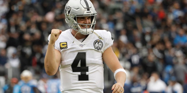 Oakland Raiders quarterback Derek Carr celebrates after a touchdown by running back DeAndre Washington during the second half of an NFL football game against the Los Angeles Chargers Sunday, Dec. 22, 2019, in Carson, Calif. (AP Photo/Marcio Jose Sanchez)