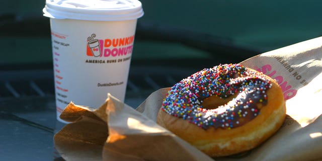 Det. Andrew Martin claims a Dunkin' employee in Menomonee Falls, Wisc., had spit into his coffee in Dec. 27. Martin's lawyers say it was because he's a police officer, but the Dunkin' employee has a different story.