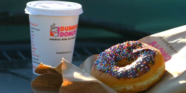 Det. Andrew Martin claims a Dunkin' employee in Menomonee Falls, Wisc., had spit into his coffee in Dec. 27. Martin's lawyers say it was because he's a police officer, but the Dunkin' employee has a different story.