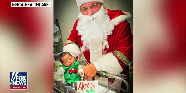 Alexis rocks her 'ugly' Christmas sweater with Santa.