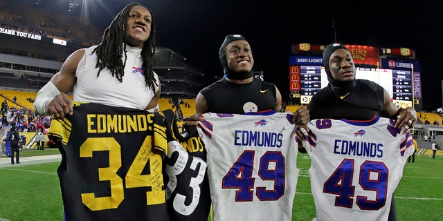 Buffalo Bills middle linebacker Tremaine Edmunds, left, swaps his jersey with his brothers Pittsburgh Steelers strong safety Terrell Edmunds, center, and Pittsburgh Steelers running back Trey Edmunds, right, following an NFL football game in Pittsburgh, Sunday, Dec. 15, 2019. The Bills won 17-10. (AP Photo/Gene J. Puskar)
