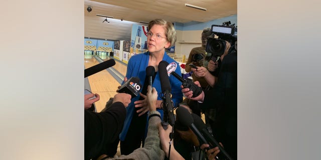 Democratic presidential candidate Sen. Elizabeth Warren of Massachusetts speaks with reporters after a town hall at a bowling alley in Peterborough, N.H., on Dec. 6, 2019