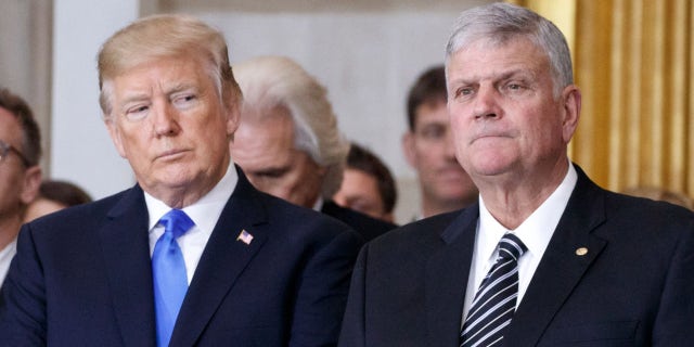 President Donald Trump and first lady Melania Trump stand with Franklin Graham during a ceremony as the late evangelist Billy Graham lies in repose at the U.S. Capitol, on February 28, 2018 in Washington, DC.  (Photo by Shawn Thew-Pool/Getty Images)