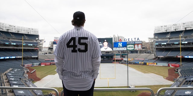Gerrit Cole poses at Yankee Stadium as the newest New York Yankees player is introduced during a baseball media availability, Wednesday, Dec. 18, 2019 in New York. The pitcher agreed to a 9-year $324 million contract.