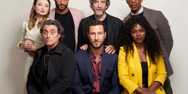 The cast of "American Gods." Counter-clockwise from the left: Emily Browning, Ian McShane, Ricky Whittle, Neil Gaiman, Pablo Schreiber, Orlando Jones, and Yetide Badakia. (Photo by Corey Nickols/Getty Images)
