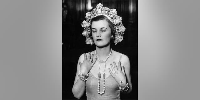 1930: The Duchess of Argyll at a dress rehearsal for the Jewels of Empire Ball at Brook House in Park Lane.